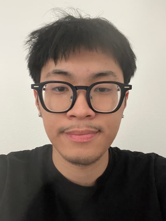 man with black t-shirt on beige background